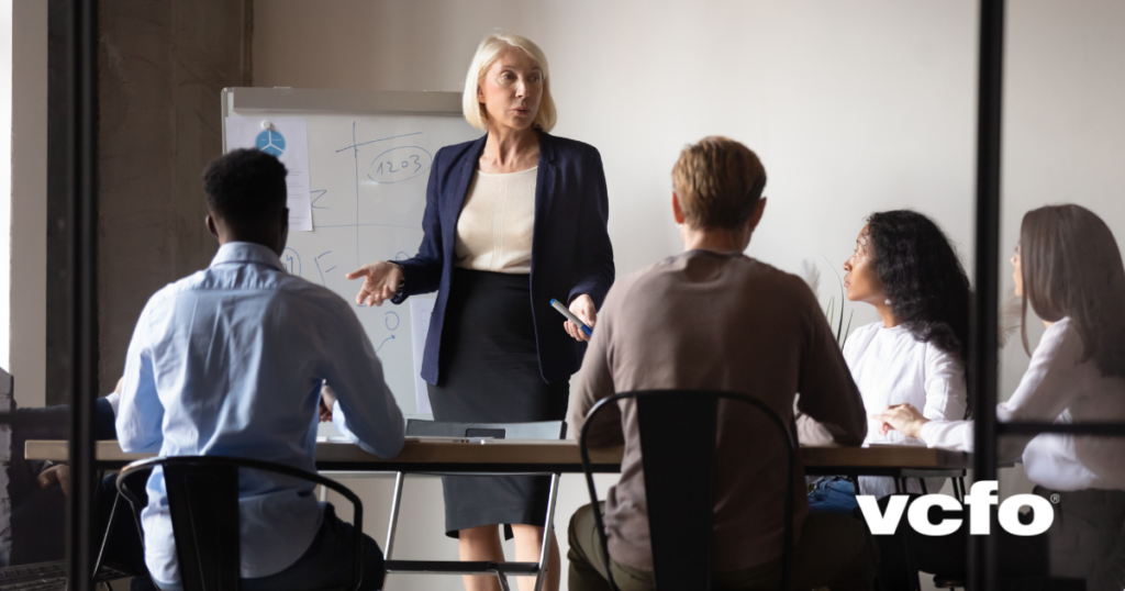 image: Woman mentoring team: practical business leadership